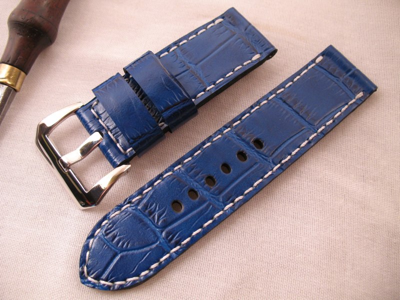 Blue embossed croc white stitch